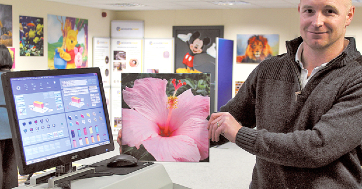 Production director Carl Tranter in his showroom and displaying a recently printed AcoustaFoam sample
