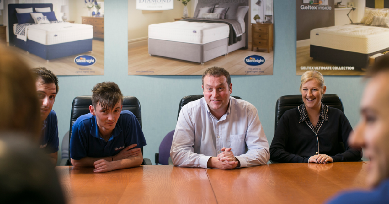 Michael Dingwall with some of current apprentices: Edson Beck and David Carter, both on Level 3 Business Admin, Junior Management apprenticeships