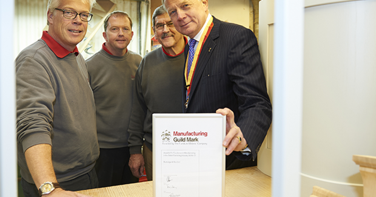 Ben Burbidge, left, accepting the certification from Paul von der Heyde, right, past master of The Furniture Makers’ Company
