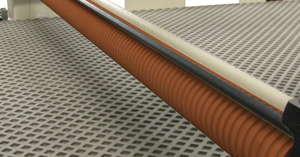 Grooved, rubber-coated, pressure rollers