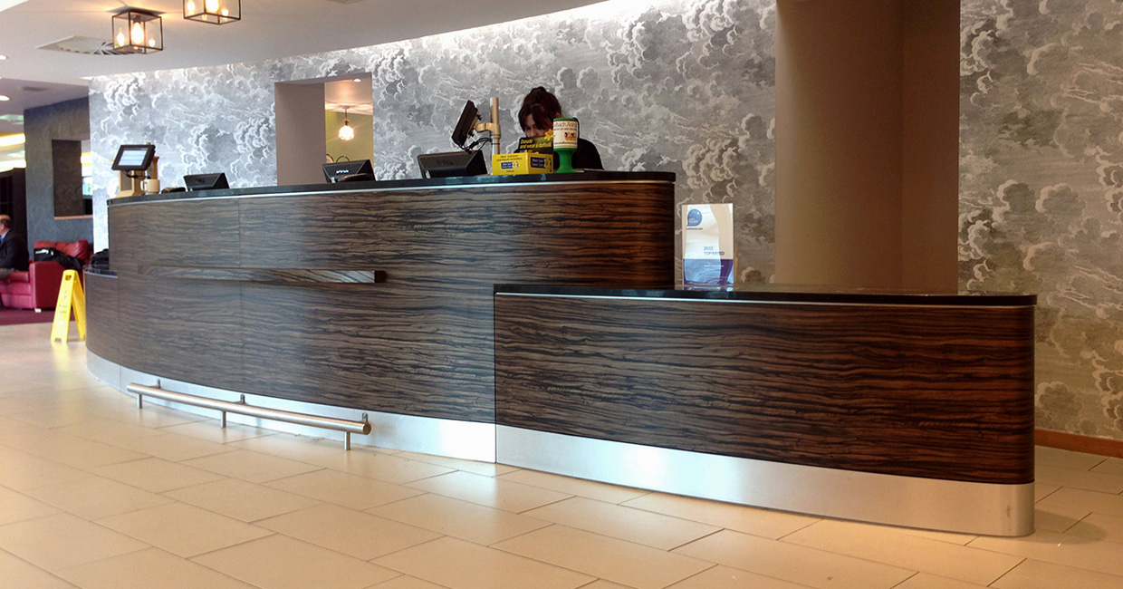 Kew Green Hotels Group used DI-NOC to refurbish the curved main reception desk at its Ibis Styles Crewe outlet