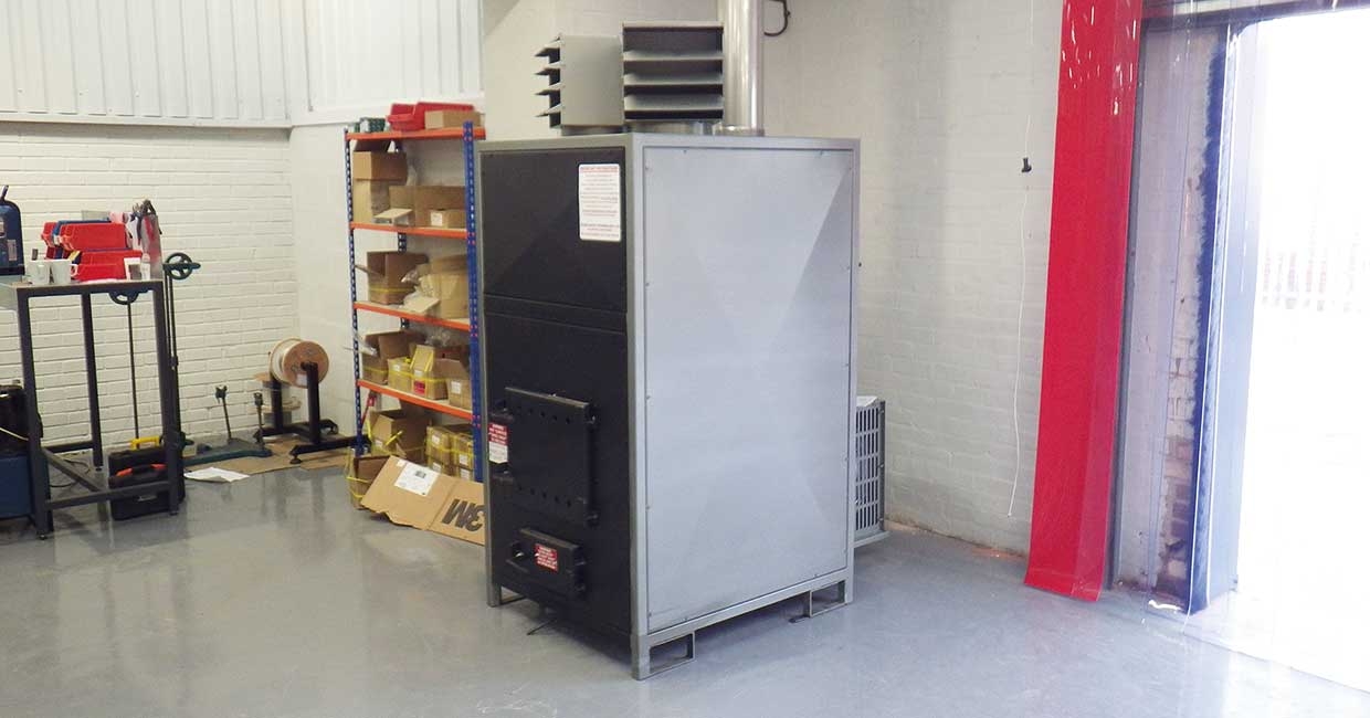 Insulation business buys wood waste heater to save money on heating bills