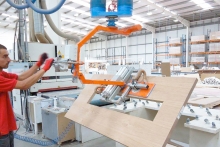 Vacuum tube lifting for industrial wood processes 